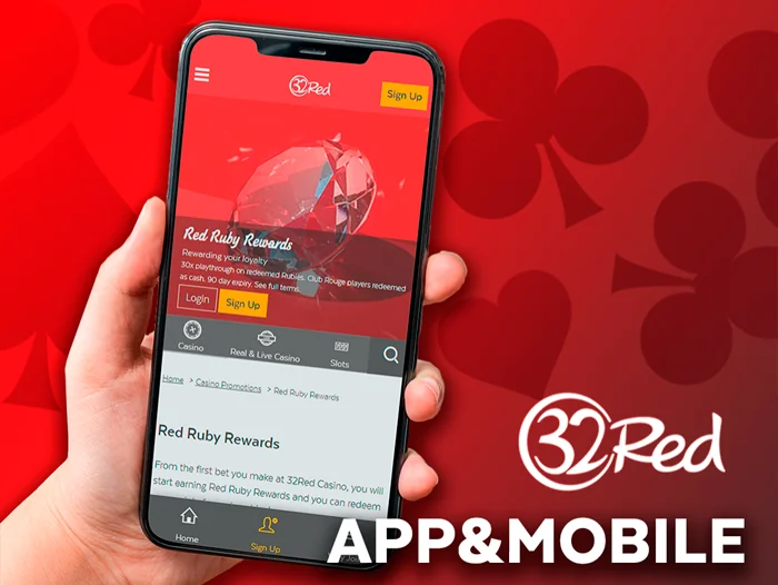 the hand holds the smartphone on which the 32Red casino website is open